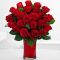 two dozen red roses in vase